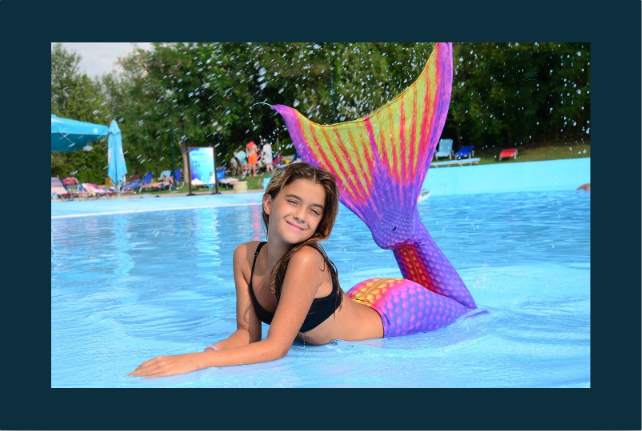 Album page: a girl in a mermaid tail in the pool